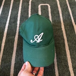 Axel arigato hat in green